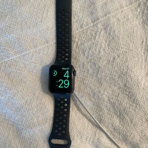 Nike Apple Watch Series 5 with charging chord
